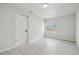 This bright bedroom features a window and light, wood-look flooring at 3414 Lindsey St, Dover, FL 33527