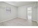 Bedroom with a window and wire closet racks at 3414 Lindsey St, Dover, FL 33527