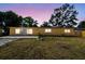 Charming single-story home featuring a well-maintained front lawn and a warm, inviting exterior at 3414 Lindsey St, Dover, FL 33527