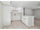 Modern kitchen featuring white cabinets, sleek countertops, and a stylish backsplash at 3414 Lindsey St, Dover, FL 33527