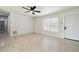 Bright living room featuring a ceiling fan, wood-look flooring, and a window for natural light at 3414 Lindsey St, Dover, FL 33527
