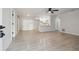 Bright, open-concept living space with modern flooring, a ceiling fan and a stylish kitchen at 3414 Lindsey St, Dover, FL 33527