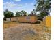 Well-kept single-story home featuring a landscaped side yard and fenced property line at 3414 Lindsey St, Dover, FL 33527
