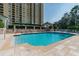 Resort-style pool with surrounding lounge chairs and building in the background at 345 Bayshore Blvd # 808, Tampa, FL 33606