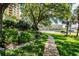 Landscaped pet walk with a winding path and lush greenery at 345 Bayshore Blvd # 808, Tampa, FL 33606
