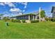 Exterior view showing a house with a screened patio at 3603-B Avenida Madera, Bradenton, FL 34210