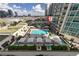 Breathtaking aerial view featuring outdoor lounge areas, a swimming pool, and manicured landscaping at 450 Knights Run Ave # 407, Tampa, FL 33602