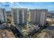 Aerial view of the high-rise with pool and city views at 450 Knights Run Ave # 407, Tampa, FL 33602
