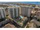 Aerial view captures luxury condos with a pool and courtyard, with water views nearby at 450 Knights Run Ave # 407, Tampa, FL 33602