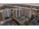 An aerial view of a luxury condominium complex showcasing the pool, lawn, and nearby waterfront at 450 Knights Run Ave # 407, Tampa, FL 33602