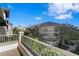Enjoy the neighborhood views from the balcony of this condo featuring a stone rail and lush landscaping at 450 Knights Run Ave # 407, Tampa, FL 33602