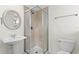 Cozy bathroom featuring a glass shower, sink with mirror, and a toilet with chrome hardware at 450 Knights Run Ave # 407, Tampa, FL 33602