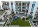 Beautiful condo courtyard features a cozy lounge area, fire pit, and well-manicured greenery at 450 Knights Run Ave # 407, Tampa, FL 33602