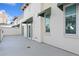 Spacious outdoor patio area with sliding glass doors and green awnings at 450 Knights Run Ave # 407, Tampa, FL 33602