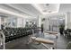 Well-equipped gym featuring dumbbells, workout machines, and mirrors, fostering a healthy and active lifestyle for residents at 450 Knights Run Ave # 407, Tampa, FL 33602
