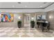 Elegant lobby area with grand piano and checkered flooring at 450 Knights Run Ave # 407, Tampa, FL 33602