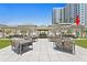 Beautiful rooftop terrace showcasing outdoor dining and a central bar area perfect for entertaining at 450 Knights Run Ave # 407, Tampa, FL 33602