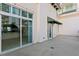 Private patio with sliding glass doors and green awning at 450 Knights Run Ave # 407, Tampa, FL 33602