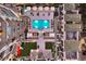 Aerial view of the pool, hot tub, and courtyard area at night at 450 Knights Run Ave # 407, Tampa, FL 33602