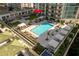 Luxury condo complex featuring a beautiful swimming pool, cabanas, and outdoor lounge spaces at 450 Knights Run Ave # 407, Tampa, FL 33602