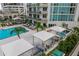Inviting condo pool and spa area with cabanas and lush landscaping for ultimate relaxation at 450 Knights Run Ave # 407, Tampa, FL 33602