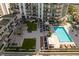 Lush rooftop pool area with comfortable lounge chairs and stylish pergolas for relaxation at 450 Knights Run Ave # 407, Tampa, FL 33602