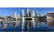 The beautiful Tampa skyline reflecting on the water, displaying iconic buildings against a blue sky at 450 Knights Run Ave # 407, Tampa, FL 33602