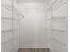 Spacious walk-in closet featuring metal shelving and ample storage space for organization at 450 Knights Run Ave # 407, Tampa, FL 33602