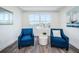 Relaxing sitting area with water views and comfortable chairs at 455 Pinellas Bayway S # 4A, Tierra Verde, FL 33715