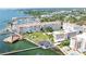Aerial view of waterfront community with marina, buildings, and landscaped grounds at 632 Edgewater Dr # 532, Dunedin, FL 34698