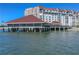 Elevated waterfront clubhouse with red roof at 632 Edgewater Dr # 532, Dunedin, FL 34698