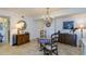 Charming dining area with chandelier and table for four at 632 Edgewater Dr # 532, Dunedin, FL 34698