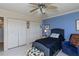 Bedroom with twin bed, ceiling fan and closet at 632 Edgewater Dr # 532, Dunedin, FL 34698