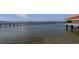 Long pier extending into the water with city views at 632 Edgewater Dr # 532, Dunedin, FL 34698