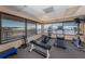 Fitness center with cardio equipment and water views at 632 Edgewater Dr # 532, Dunedin, FL 34698