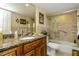 Bathroom with granite countertop, tub, and shower at 632 Edgewater Dr # 532, Dunedin, FL 34698