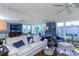 Bright living room, hardwood floors, and water views at 632 Edgewater Dr # 532, Dunedin, FL 34698