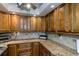 Updated kitchen with granite countertops and ample cabinet space at 632 Edgewater Dr # 532, Dunedin, FL 34698