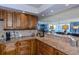 Kitchen features granite countertops and beautiful wood cabinets at 632 Edgewater Dr # 532, Dunedin, FL 34698