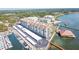 Aerial perspective of a waterfront condo building with parking and boat slips at 632 Edgewater Dr # 532, Dunedin, FL 34698