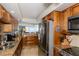 Modern kitchen with stainless steel appliances and granite countertops at 632 Edgewater Dr # 532, Dunedin, FL 34698