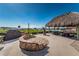 Community fire pit with seating and ocean view at 632 Edgewater Dr # 532, Dunedin, FL 34698