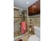 Bathroom with shower stall and tiled walls at 632 Edgewater Dr # 532, Dunedin, FL 34698