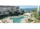Resort-style pool with patio furniture, offering a relaxing waterfront view at 632 Edgewater Dr # 532, Dunedin, FL 34698