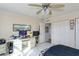 Bedroom with desk, closet and ceiling fan at 632 Edgewater Dr # 532, Dunedin, FL 34698