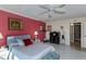 Relaxing bedroom with ceiling fan and ensuite bathroom at 632 Edgewater Dr # 532, Dunedin, FL 34698