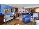 Bright living room features hardwood floors, comfortable seating, and an open layout at 632 Edgewater Dr # 532, Dunedin, FL 34698