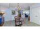 Elegant dining area with chandelier and view to living room at 632 Edgewater Dr # 532, Dunedin, FL 34698