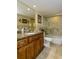 Bathroom with granite countertop, tub, and shower at 632 Edgewater Dr # 532, Dunedin, FL 34698