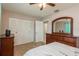 Bedroom with double bed, dresser, and large closet at 741 Windward Way, Palm Harbor, FL 34685